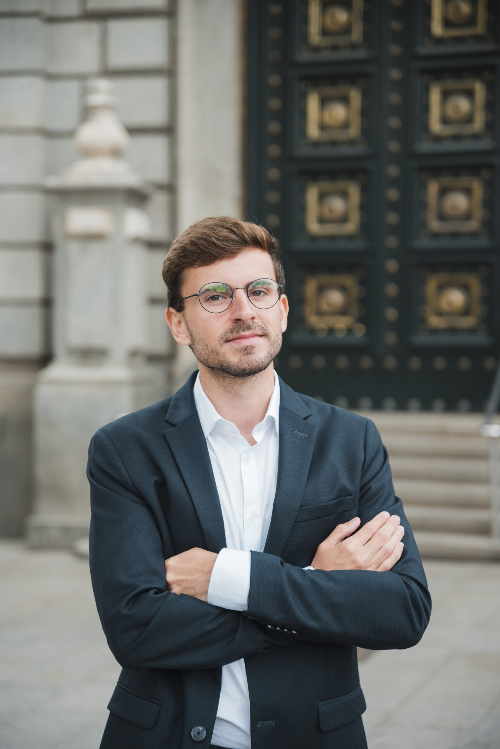 portrait-confident-young-businessman-with-his-arms-crossed